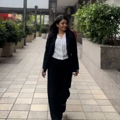Walking with purpose through a business district. My aim is to be a voice for my clients, not an echo in the legal system.