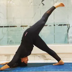 This is Three-Legged Downward Dog, a great pose for opening the hips and stretching the hamstrings. I always remind myself to feel gratitude for what my body can do each day.