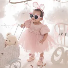 Celebrating a first birthday with style and a bit of fun. This portrait shows your child's budding personality, set against a dreamy, cloud-like backdrop that I designed to make the moment magical.