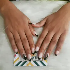 This design combines two trends: the French tip and flame art. I created black flame outlines on the tips of these oval nails for an edgy yet subtle manicure.