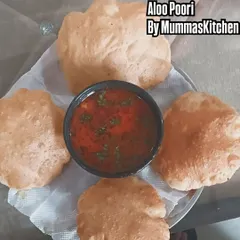 A classic weekend breakfast of Aloo Poori. The pooris are puffed up and golden, served with a simple and flavorful potato curry.