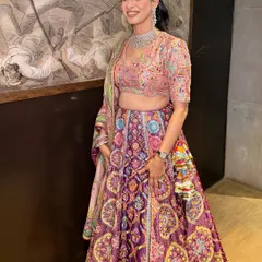 A full view of Priyanka's vibrant party look. The makeup is kept fresh and radiant to complement the colorful Mayyur Girotra lehenga.