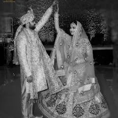 A playful black and white shot of the groom twirling his bride. We love capturing these dynamic and happy moments that show the fun side of your relationship.
