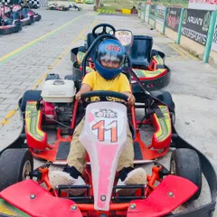 A young driver looking confident and ready to go in one of our baby karts. We make sure the experience is safe and fun for all age groups.