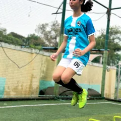 It all starts with the fundamentals. Here, one of our players works on her agility and speed with hurdle drills, building the athletic foundation needed for high-level football.