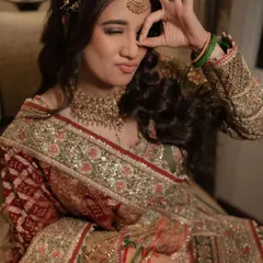 A bride who is the life of the party! Her playful and joyful spirit shines through in this candid shot from her Mehendi ceremony.