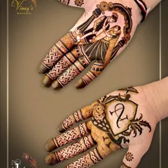 This groom's mehndi combines a personal touch with storytelling. One hand features a custom crest with the couple's initials, while the other depicts a romantic dance scene, framed by intricate patterns.