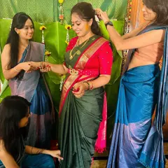 A bride surrounded by her tribe. I designed the bride's green and pink saree and blouse, and also coordinated outfits for her bridesmaids for the Haldi ceremony.