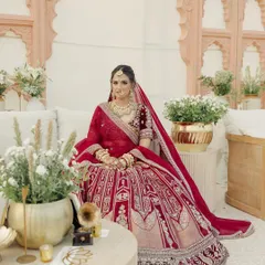 A quiet moment amidst the grandeur. Janvi's makeup was designed to look flawless both up close and from a distance, with a focus on luminous skin and softly defined eyes.