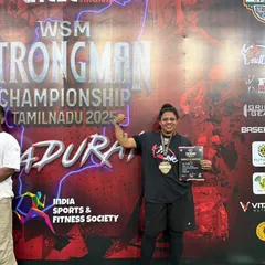 Holding my certificate and medal at the Strongman Championship. Every competition teaches me more about strength and resilience, lessons I pass on to all my clients.