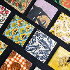 A few of our favorite hand-painted tiles from our wall project. We’ve got everything from Batman and smiley faces to cookies and abstract patterns. Each one is a tiny piece of art.
