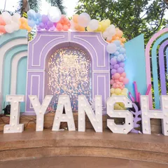 We can transform any space into a magical world. This large-scale "Under the Sea" theme features custom-built pastel arches, shimmering sequin backdrops, and marquee letters spelling out the birthday girl's name, Viyanshi.