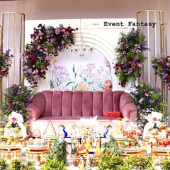 This is the full stage setup for a modern engagement. The design features a central floral backdrop, flanked by elegant gold-toned pillars and arches, creating a look of contemporary luxury.