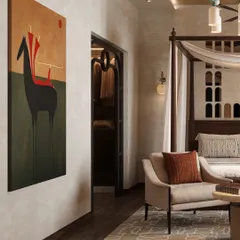 A bold piece of contemporary art adds a splash of color and personality to the otherwise neutral and calming bedroom. The view also shows the entrance to the walk-in closet.