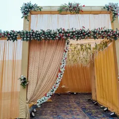 A closer look at the floral details on the wedding entrance. I use a mix of real and artificial flowers to create a lush, full look along the top and sides of the entryway.