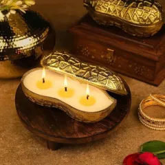 My festive collection includes these unique urli candles shaped like peanuts, almonds, and other dry fruits. Crafted from aluminum with a golden finish, they offer a playful and luxurious twist on traditional decor.