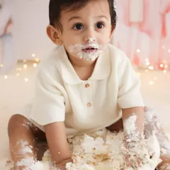 Pure, unfiltered joy. A first birthday cake smash is a celebration of a huge milestone, and I love capturing the messy, wonderful chaos of it all. This image is the essence of that fun, a memory of sweet treats and even sweeter giggles.
