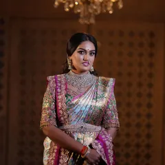 A regal portrait session for a client, featuring a stunning hand-embroidered blouse and a beautiful Kanjeevaram saree. The makeup was designed to give a royal, timeless feel.