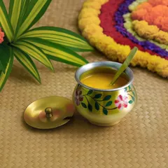 This hand-painted ghee pot is a beautiful example of redesigned traditional accents. It is a sustainable and thoughtful gift that adds a festive touch to any home.