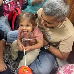 A beautiful moment of connection during our festival celebrations. Here, a father and daughter are enjoying a craft activity together, creating memories that will last a lifetime.