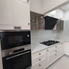 From render to reality. This is a completed PU finish modular kitchen in Bangalore, showing the clean lines, integrated appliances like the built-in oven, and smart storage solutions that I bring to my projects.