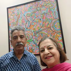 My aunt and uncle with the artwork in their new home. It makes me so happy to see my art bringing joy to the people I love.