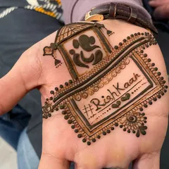 A creative and personalized design for the groom, featuring a doli, Lord Ganesha, and the wedding hashtag '#RishKaah'.