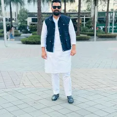 Dressed in traditional kurta pajama with a vest. I believe in focusing on the positive and living life to the fullest, a philosophy that balances the rigors of my profession.
