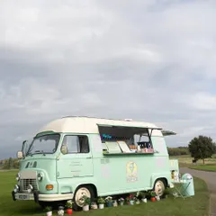 A vintage, mint-green ice cream truck serving sweet treats at a countryside Mehendi. A delightful touch of nostalgia that guests loved.
