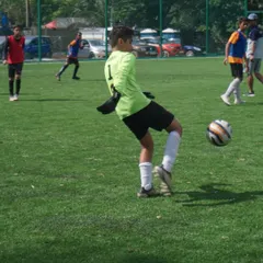 A young keeper practices his distribution with a powerful kick during trials. We train our goalkeepers not just to stop shots, but to be the first point of attack with accurate long balls and throws.