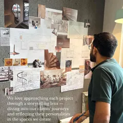 We love approaching each project through a storytelling lens, diving into our clients' journeys and reflecting their personalities in the spaces we create. Here's Sid, contemplating a mood board in our studio.