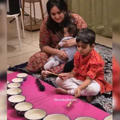 A mother and her children creating music and memories together during our Jaltarang camp. We design our workshops not as drop-off classes, but as shared spaces where families can bond over the delightful sounds of Indian music.