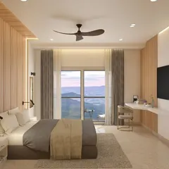 Designed for a hotel with a view, this bedroom uses a clean, minimal aesthetic to keep the focus on the stunning landscape outside. A floating desk and vertical wood paneling add a touch of modern functionality.