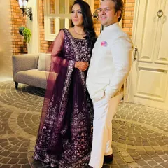 Here I am with my brother and co-founder, Nikhil. I'm wearing a classic, all-white custom Jodhpuri suit, a perfect example of how we blend traditional silhouettes with clean, modern tailoring.