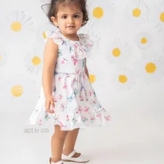This little pro poser is ready for her close-up. Even at a young age, we can capture beautiful portraits that showcase your child's budding personality.