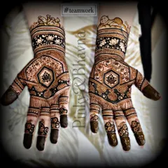 A symmetrical design showcasing our teamwork. Both hands feature a central lotus in a hexagon, surrounded by intricate patterns and baby figures on the wrist.