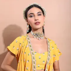 A duplicate of the modern ethnic look, focusing on the intricate jewelry and the fresh, spring-like feel of the floral headband.