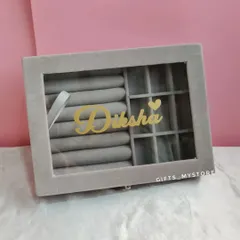 A personalized jewelry organizer with her name in gold. It's a stylish and practical gift that she can use every day.