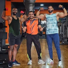 Surrounded by strength and motivation. Posing with fellow fitness enthusiasts at OxFit Gym after a great workout.
