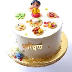 A special cake for a Bengali Annaprasan, or Rice Ceremony. This Chocolate Truffle cake is decorated with handcrafted, edible elements representing the traditional items used in the ceremony.