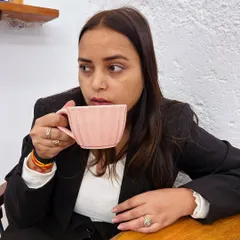 A thoughtful moment over a cup of coffee. Sometimes the best legal strategies come to mind during quiet moments away from the office.