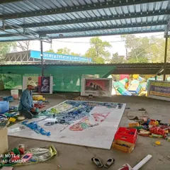 Artist Sunil Vyas is seen here working on a large-scale mosaic made from plastic waste. His work, part of the Swachh Bharat Abhiyan, transforms discarded materials into incredible art, promoting a message of sustainability.