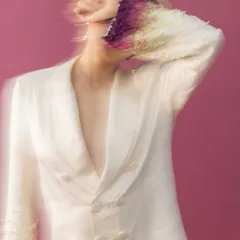 Using motion blur, I captured a sense of dynamic energy in this shot. The styling pairs a structured, double-breasted blazer with unique gradient sleeve embellishments, creating a narrative of avant-garde sophistication and artistic expression.