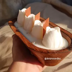 My wooden boat candles are a rustic and elegant decor piece. This one features four white tulip-shaped candles with wooden wicks that crackle gently when lit.