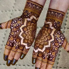 The stained result of a heavy mandala design. The dark maroon color shows the quality of my natural henna paste. Notice how the central mandala is surrounded by delicate floral work.