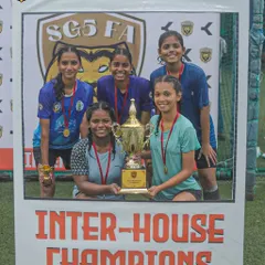 We are committed to growing the sport for everyone. This photo celebrates the champions of our SGS Lioness Inter-House tournament, showcasing our capability in organizing competitive and inclusive women's football events.
