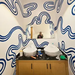 A selfie break while working on a custom abstract line mural for a cafe's washroom. Even small spaces can make a big impact with the right design.