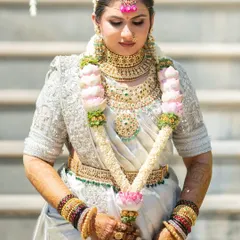 The final, mature stain after 48 hours. The bride's hands are adorned with a deep, reddish-brown color that looks absolutely stunning with her white and gold wedding saree.