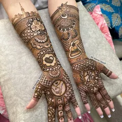 Your love story is unique, and your mehndi should be too. For this bride, I incorporated the Dubai skyline, a place special to her, along with the couple's initials and a symbol of their bond.