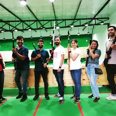 Another happy group after a fun shooting session. I love seeing people get excited after they try hitting the target for the first time. It's a great stress buster.